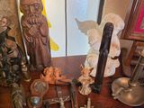 many religious items on a table in a room