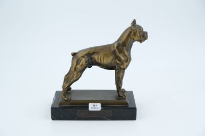 bronze statue of a dog on a marble base on a white background