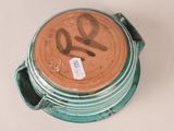a close up of a bowl with a tag on it