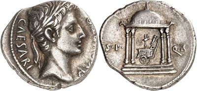 a silver coin with an image of a woman holding a cage