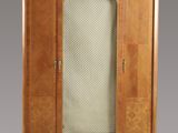 a cabinet with a marble top and a glass door