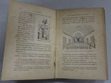 an open book with a drawing of a building on it