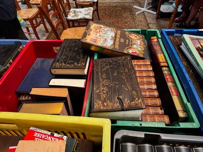 a lot of books that are sitting on a table