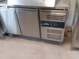 a stainless steel counter with a sink and a dishwasher on it