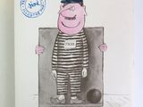 une photo d'un livre sur laquelle figure l'image d'un homme en tenue de prisonnier