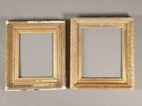 pair of antique gold picture frames on a gray background