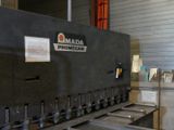 a picture of a machine that is working on a piece of metal