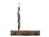 a bassoon sitting on top of a piece of wood