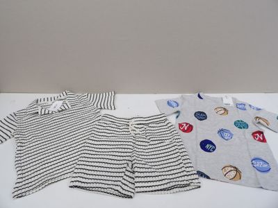 three pieces of clothing on a table with buttons on them
