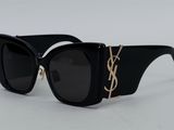 Lunettes de soleil noires Saint Laurent ornées d'une chaîne dorée