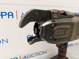 a close up of a wrench on a stand