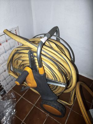a hose and a pair of scissors on the floor