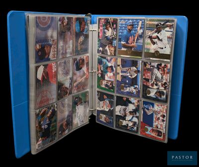 a picture of a blue folder with baseball cards inside of it