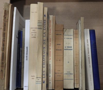 many books that are on a shelf in the room