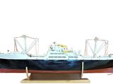 a model of a large boat on a wooden stand
