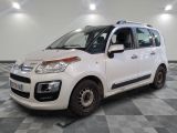 a picture of a white citrole parked in a room