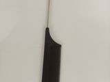 a black comb and a black comb on a white surface