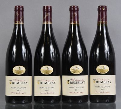 three bottles of red wine are lined up on a table