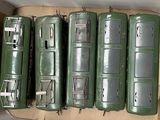 four green boxes with metal latches on them