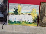 three paintings on the wall next to each other