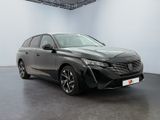 the front view of a grey car in a white room