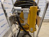 an image of a machine with a hose attached to it