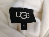 the ugg label is on the back of a white shirt