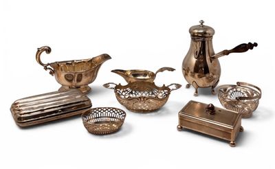 an assortment of silver plated items including a teapot, tray, and other items