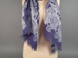 a purple and white scarf on a mannequin dummy