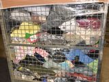 a metal cart with many items in it in a warehouse