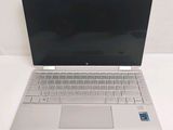 a laptop that is sitting on a white table