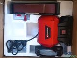 a box with a sander, sander, and other items in it