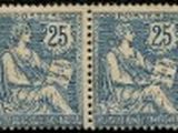 two blue and white postage stamps with a woman sitting on a bench