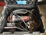 a tool box with tools in it sitting on the floor