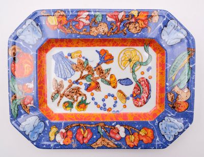 a colorful tray with a picture of fruits and flowers on it