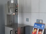 a machine that is sitting on a counter in a kitchen