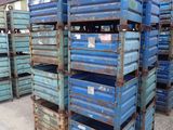 a lot of blue crates stacked on top of each other