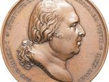 une image représentant une médaille de bronze sur laquelle figure le visage d'un homme