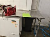 a red bag sitting on top of a refrigerator in a kitchen