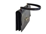 a black purse with a gold clasp on it