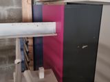 a picture of a room with a lot of boxes and a pipe
