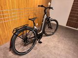 a bike that is parked in front of a wall