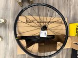 a close up of a bicycle wheel and a box of shoes