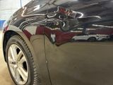 a close up of a car ' s paint job on the side of the car