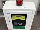 a white box with a red light on top of it