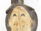 a small statue of a man with a hat on it