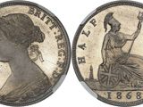 a silver coin with a woman sitting on top of it