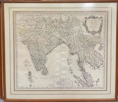 an old map of india in a wooden frame on a wall