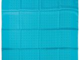 a teal blue banda with white dots on it