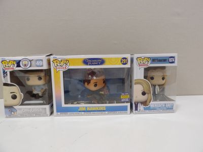 three funko pop vinyl figures of a man and a woman in suits
